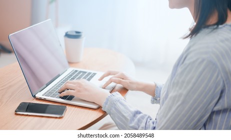 
Image of a woman using a laptop computer