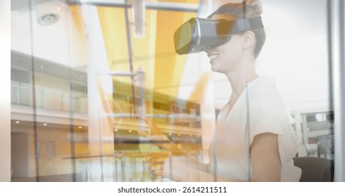 Image of women using vr headset over server room. global connections, business, digital interface, technology and networking concept digitally generated image.