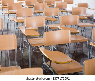 Image Of Wooden Chairs In Rows In Classroom Of School Interior, No People

