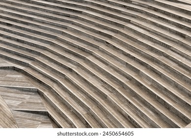 The image is of a wooden staircase with a series of steps. The steps are arranged in a way that creates a sense of depth and perspective - Powered by Shutterstock