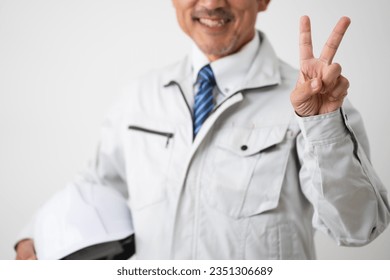 Image of work clothes for middle-aged men who make a peace sign