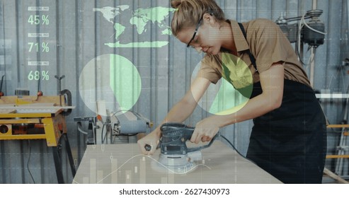 Image of world map and data processing over caucasian female carpenter working in workshop. Global communication, work and digital interface concept digitally generated image.