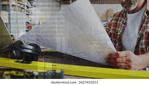 Image of world map and data processing over caucasian male carpenter working in workshop. Global communication, work and digital interface concept digitally generated image.