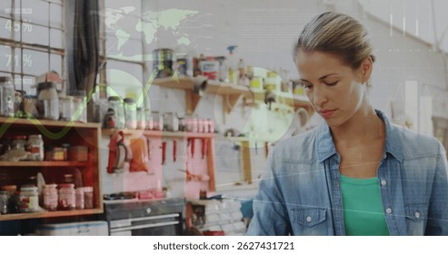 Image of world map and data processing over caucasian female carpenter working in workshop. Global communication, work and digital interface concept digitally generated image. - Powered by Shutterstock - Get 15% off with code: PIKWIZARD15
