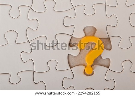 The image of a yellow question mark on a jigsaw puzzle background conveys the ideas of problem-solving, confusion, seeking solutions, and counseling.
