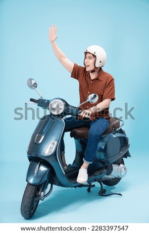 Image of yougn Asian man on motorbike