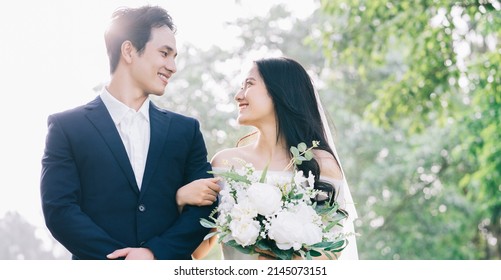 Image of young Asian bride and groom - Powered by Shutterstock