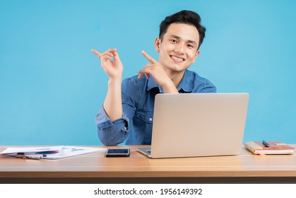 Image Of Young Asian Buisnessman On Blue Background