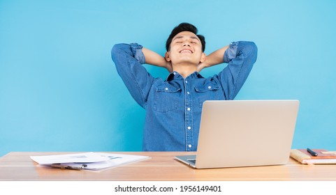 Image Of Young Asian Buisnessman On Blue Background