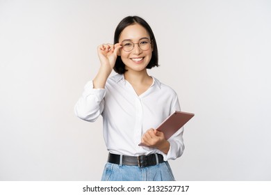 Image Of Young Asian Business Woman, Female Entrepreneur In Glasses, Holding Tablet And Looking Professional In Glasses, White Background