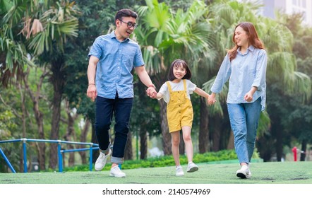 Image Of Young Asian Family Playing Together At Park