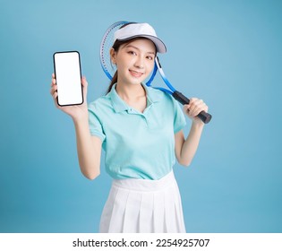 Image of young Asian girl playing tennis - Powered by Shutterstock