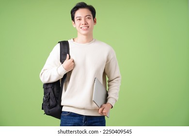 Image of young Asian student on background - Powered by Shutterstock