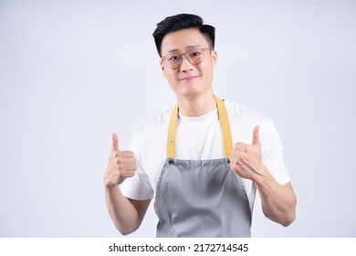 Image Of Young Asian Waiter On Background