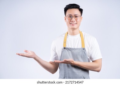 Image Of Young Asian Waiter On Background