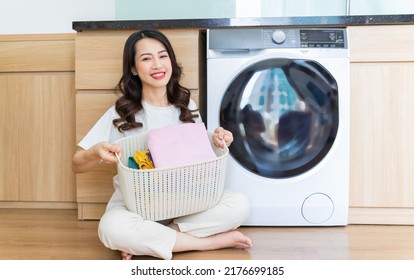 Image Of Young Asian Woman Washing Clothes