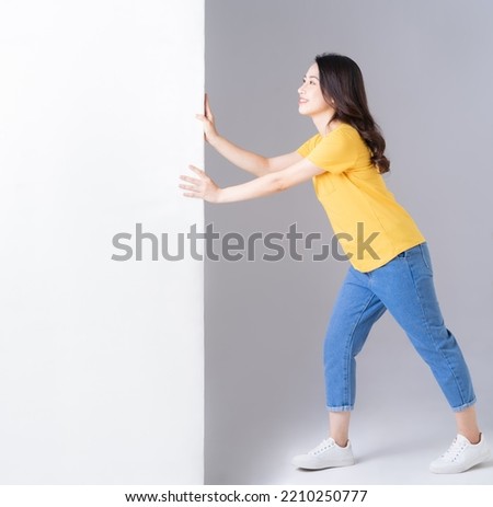 Image of young Asian woman with white board