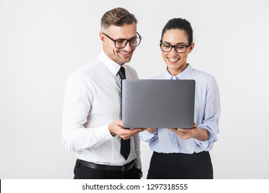 Image Of Young Business Colleagues Couple Isolated Over White Wall Background Using Laptop Computer.