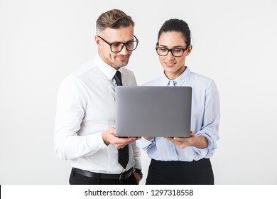 Image Of Young Business Colleagues Couple Isolated Over White Wall Background Using Laptop Computer.