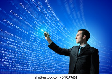 Image of young businessman touching icon of media screen