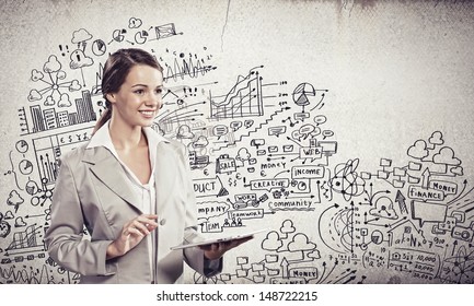 Image Of Young Businesswoman Holding Ipad Against Sketch Background