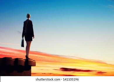 Image Of Young Businesswoman Standing On Top Of Building