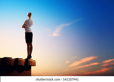 Image Of Young Businesswoman Standing On Top Of Building