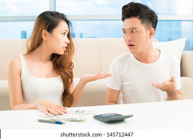 Image Of A Young Couple Having A Quarrel About Money