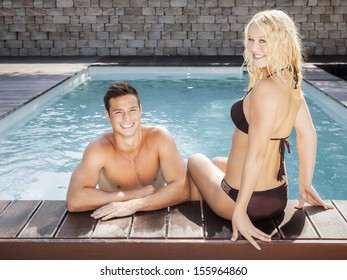 An Image Of A Young Couple At The Pool