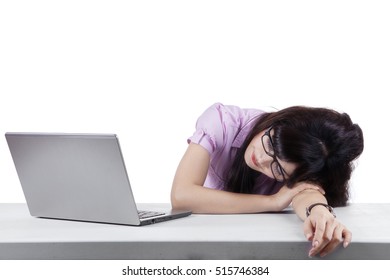 Image of young entrepreneur sleeping with laptop computer on the desk workplace