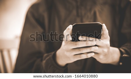 Image of young female using cellular phone