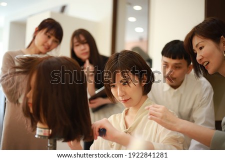 Image of a young hairdresser's class 