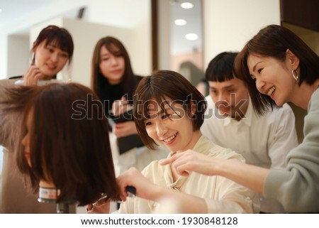 Image of a young hairdresser's class 