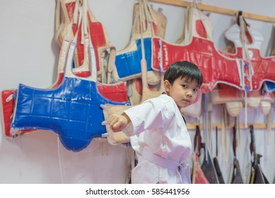 Image Of Young Handsome Asian Boy Training In Taekwondo Class