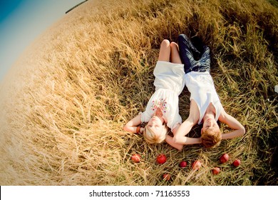 Image Of Young Man And Woman On Wheat Field