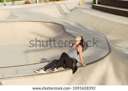 Similar – Beautiful young photographer sitting on the ground with the camera in the country