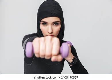 Image Of Young Woman Fitness Muslim Fighter Boxer Posing Isolated Over White Wall Background Make Exercises With Dumbbells.