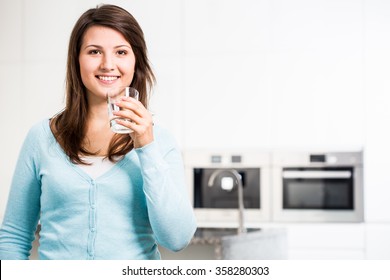 Image Of Young Woman With Glass Of Tap Water