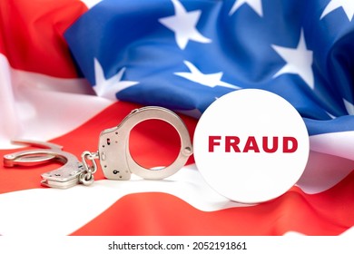 Images depicts a fraud button against handcuffs and the American flag, insinuating that fraud is a crime and those cheating people will be arrested. 