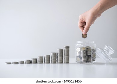 Images of growing stacking coins and Hand putting coin into glass bottle (money box) for planning step up and savings, Saving money for future plan and retirement fund concept. - Shutterstock ID 1495121456