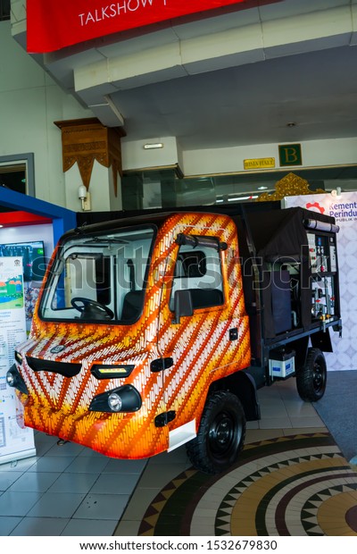 Images of mobile water
purifier cars, with the unique traditional Javanese fabric paint
motif. Photographed in low lights. Yogyakarta, Indonesia - October
13, 2019.