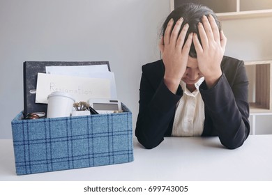 Images Of Packing Up All Her Personal Belongings And Files Into A Brown Cardboard Box And Business Woman Has Stress To Resignation In Modern Office, Resign Concept.