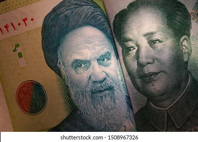  Images Of Portraits On Banknotes Of The Chinese Yuan And The Iranian Rial. As A Symbol Of Trade And Political Cooperation Between China And Iran.                              