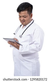 images of a serious doctor holding tablet digital browsing something