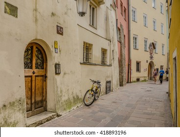 Images of  streets in the Old City of Innsbruck, Austria-August 24, 2013: Narrow, winding, cobble stones paved streets between preserved, medieval houses attract  tourists to enjoy their special charm