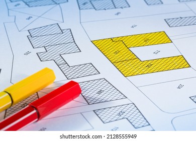 Imaginary cadastral map with buildings, land parcel and vacant plot - land and property registry and real estate property concept illustration - Shutterstock ID 2128555949