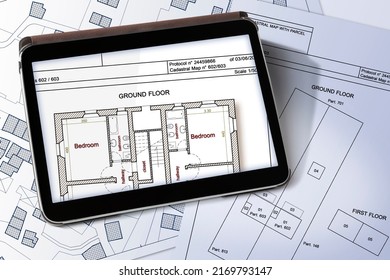 Imaginary Cadastral Map Of Territory With Buildings And Land Parcel Documents And Cadastral Interior Plan On A Digital Tablet