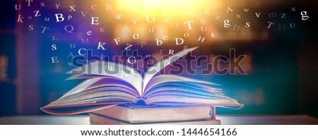 Imagine opening an old book blurred with magic power on the table and the English alphabet floating above the book with magic light as a beautiful background design.