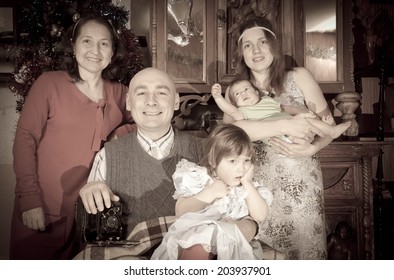 Imitation Of Aged Photo Of Christmas Portrait Of Happy Family Of Photographer