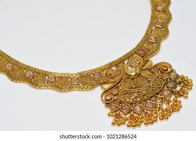 Imitation Jewelry - Golden polished and traditionally designed necklace on white background for woman fashion 